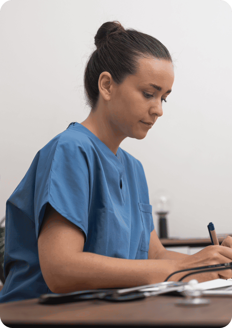 Healthcare professional taking notes